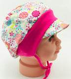 Birds and flowers cap with self fabric bow.