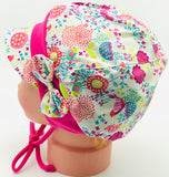 Birds and flowers cap with self fabric bow.